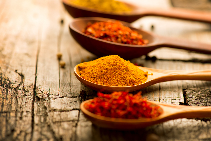 Spices. Spice over Wood. Herbs. Curry, Saffron, turmeric, cinnamon and other over wooden background